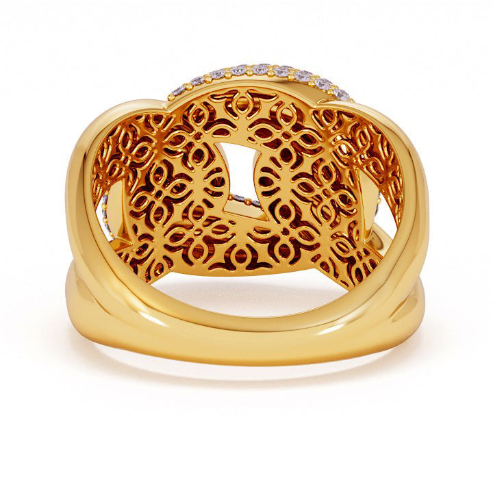 Gold ring with intricate design on a white background