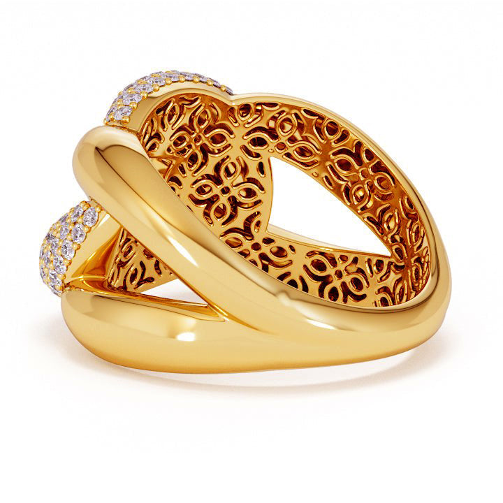 Gold ring with intricate design on a white background