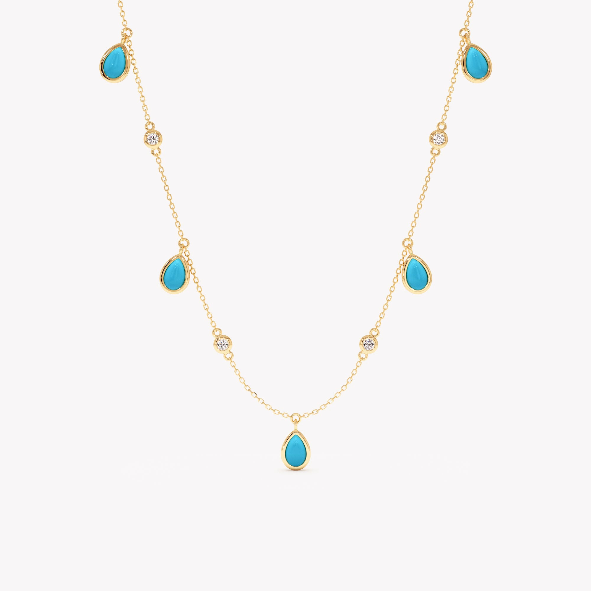 Gold necklace with turquoise teardrop-shaped stones on a white background